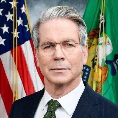 Official portrait of US Treasury Secretary Scott Bessent in front of the US and Treasury flags.