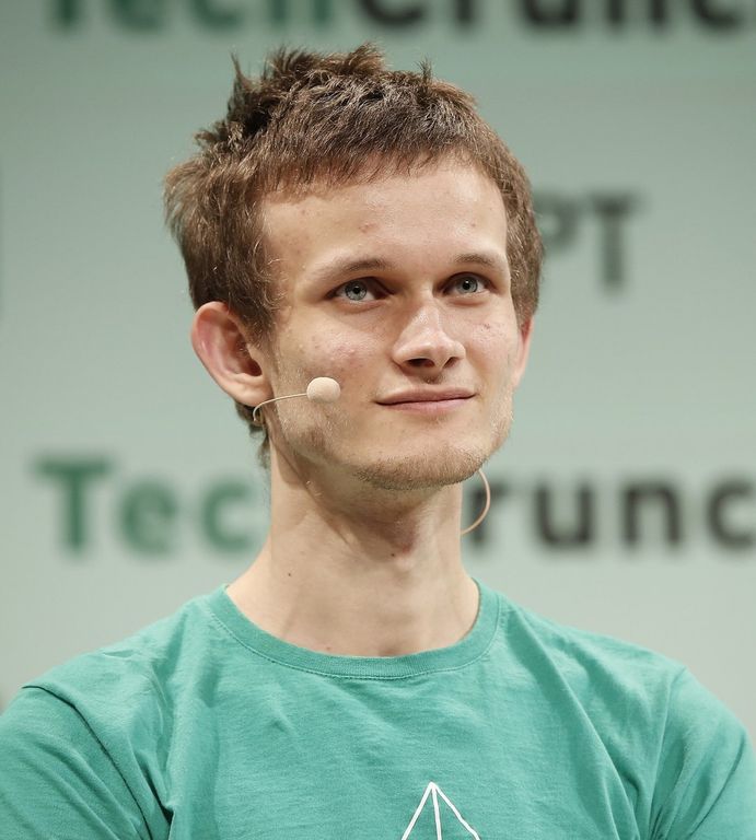 Portrait photograph of Ethereum co-founder Vitalik Buterin speaking at a conference.