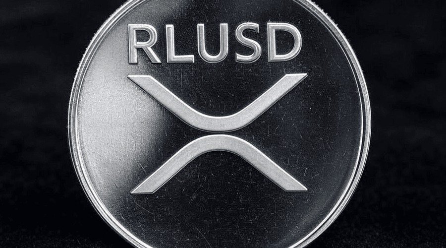 A silver coin engraved with the RLUSD text and XRP logo on a dark background