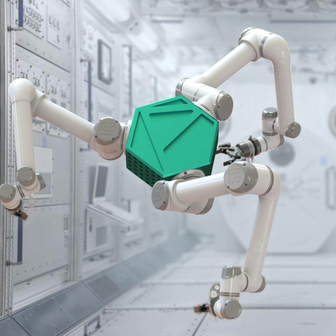 A multi-limbed white robotic manipulation mechanism with a green geometric central hub in a laboratory setting.
