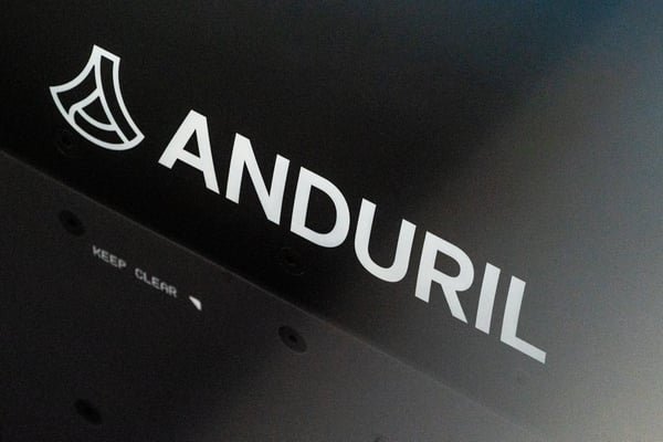 Anduril company logo and branding printed in white on a dark hardware surface.