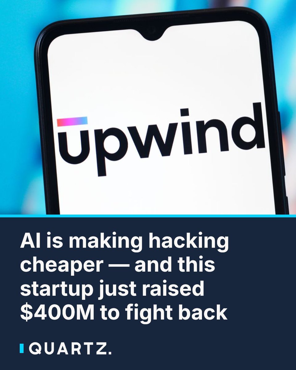 A smartphone screen displaying the Upwind company logo above a Quartz graphic headline about the startup raising $400 million.