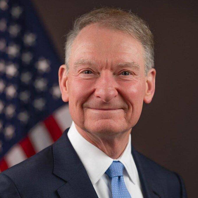 Official portrait of SEC Chairman Paul Atkins in front of an American flag.