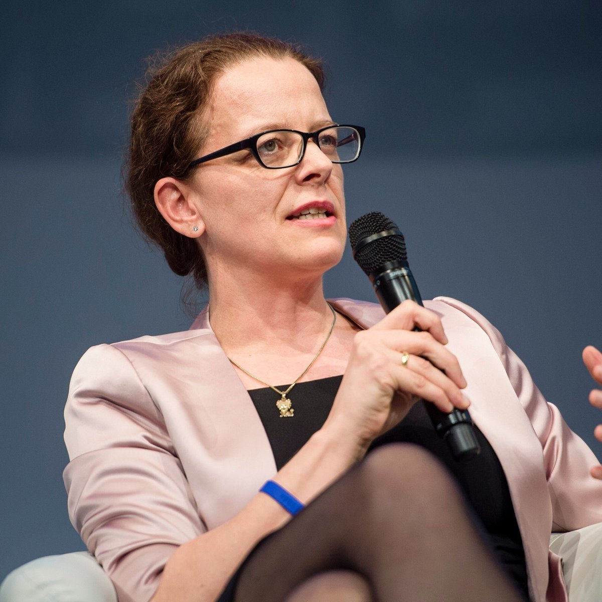ECB Executive Board member Isabel Schnabel speaking into a microphone at an event.