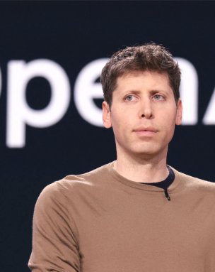 Portrait of OpenAI CEO Sam Altman against a dark backdrop displaying part of the OpenAI logo.