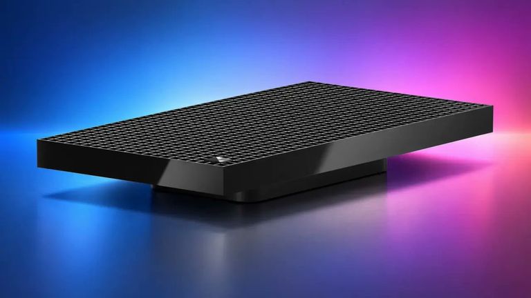 Product rendering of the black Microsoft Surface RTX Spark Dev Box desktop computer showing its top ventilation grille.