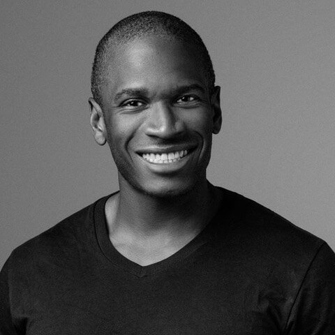 Black and white portrait photo of Arthur Hayes smiling.