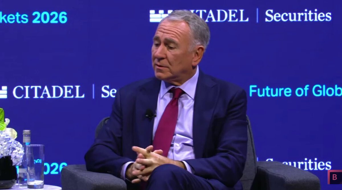 Citadel founder Ken Griffin speaking on stage in front of a Citadel backdrop.