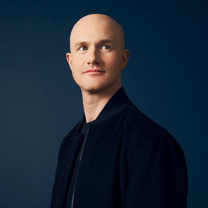 Portrait of Coinbase CEO Brian Armstrong against a dark blue background.