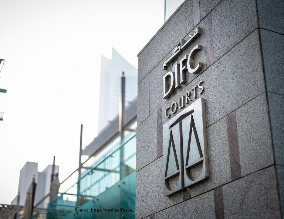Exterior signage for DIFC Courts mounted on a stone wall.