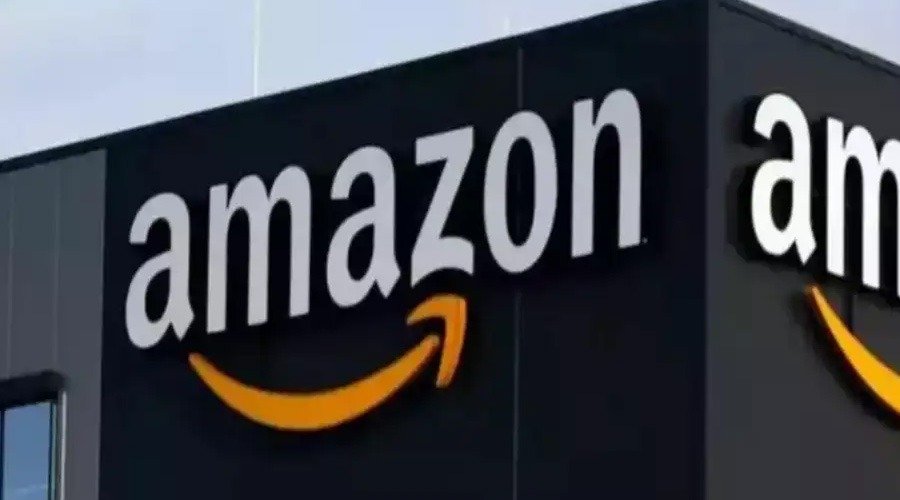 Exterior building signage displaying the Amazon logo with its signature orange smile arrow.