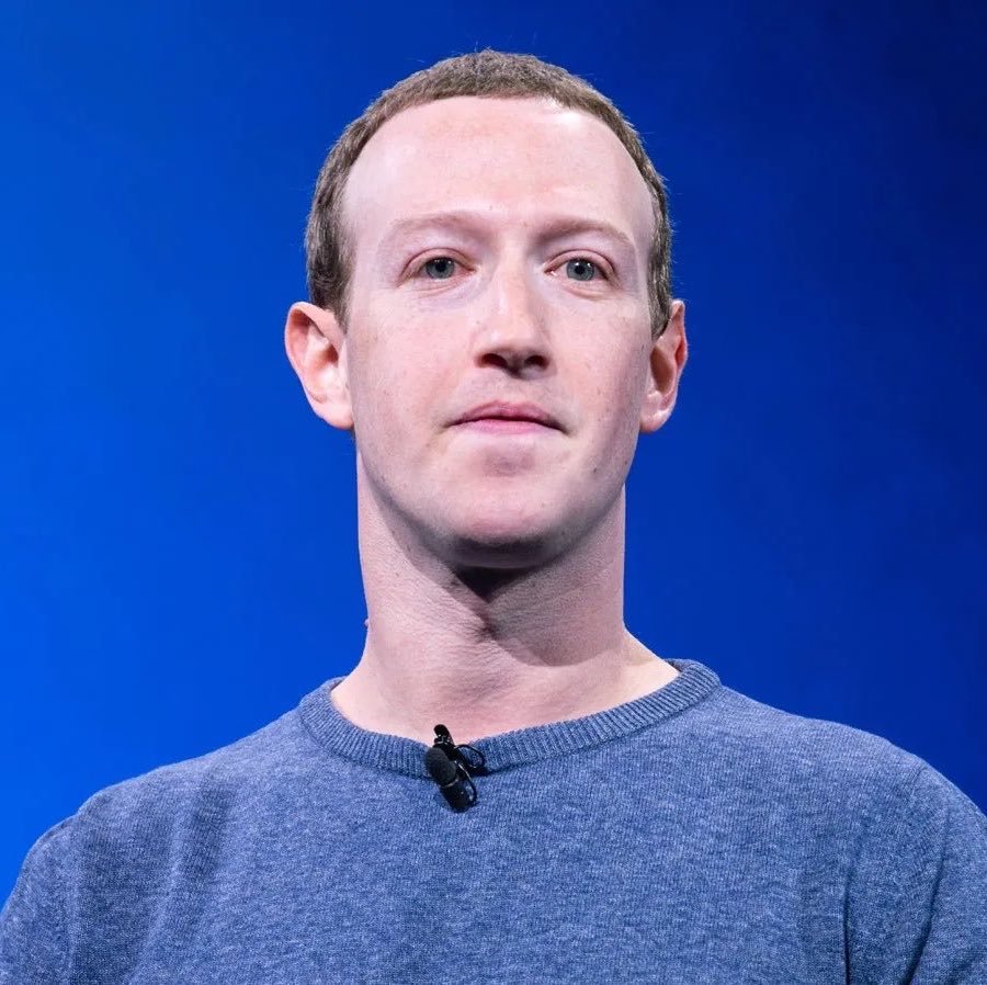 Portrait of Meta CEO Mark Zuckerberg against a blue background.