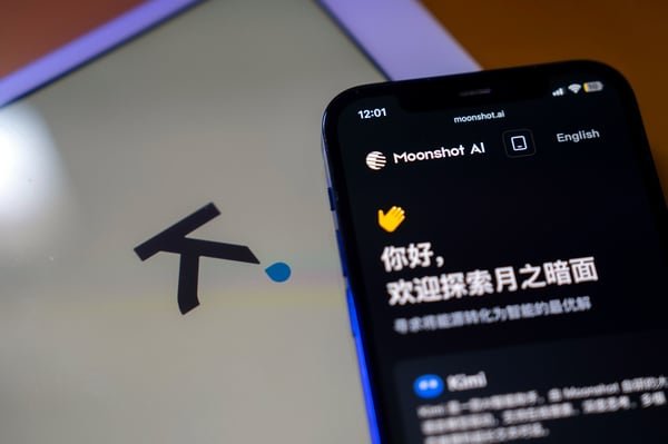 A smartphone displaying the Moonshot AI interface next to a tablet screen showing the Kimi logo.