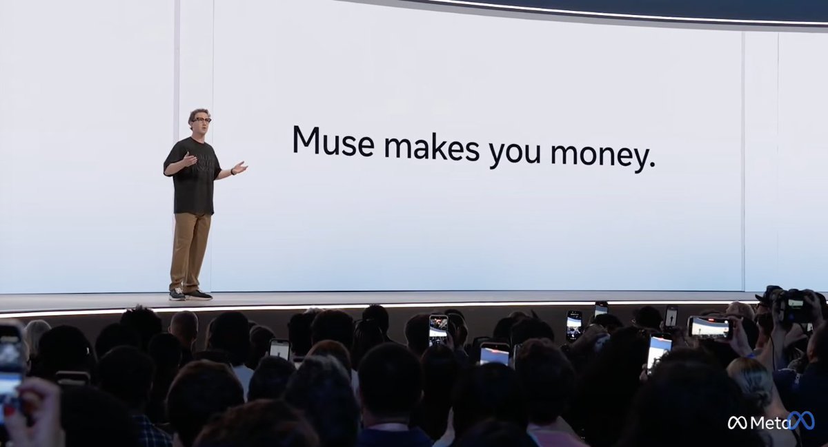 Mark Zuckerberg speaking on a presentation stage in front of a large screen reading 'Muse makes you money.'
