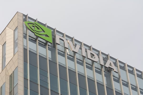 Exterior view of an Nvidia corporate building displaying the Nvidia logo on its glass facade.