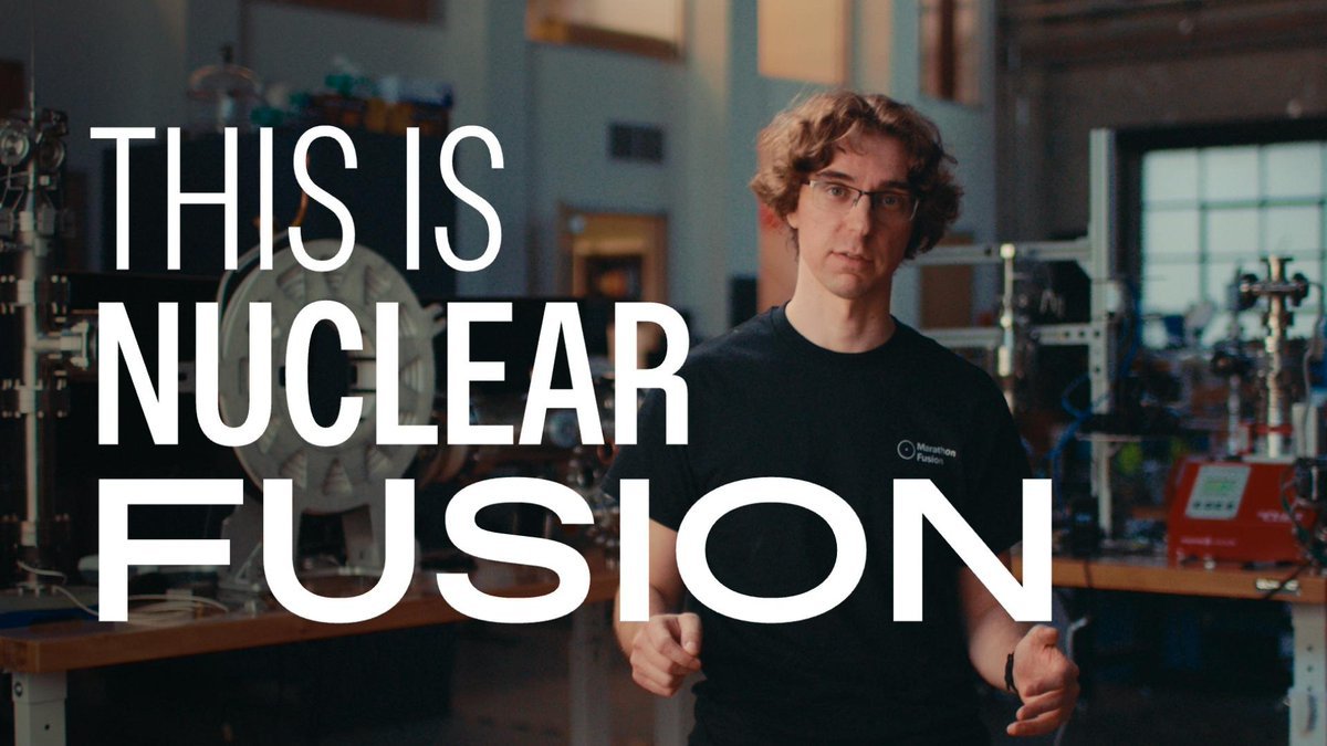 A man wearing a Marathon Fusion shirt in a laboratory with scientific machinery in the background, overlaid with the text 'THIS IS NUCLEAR FUSION'